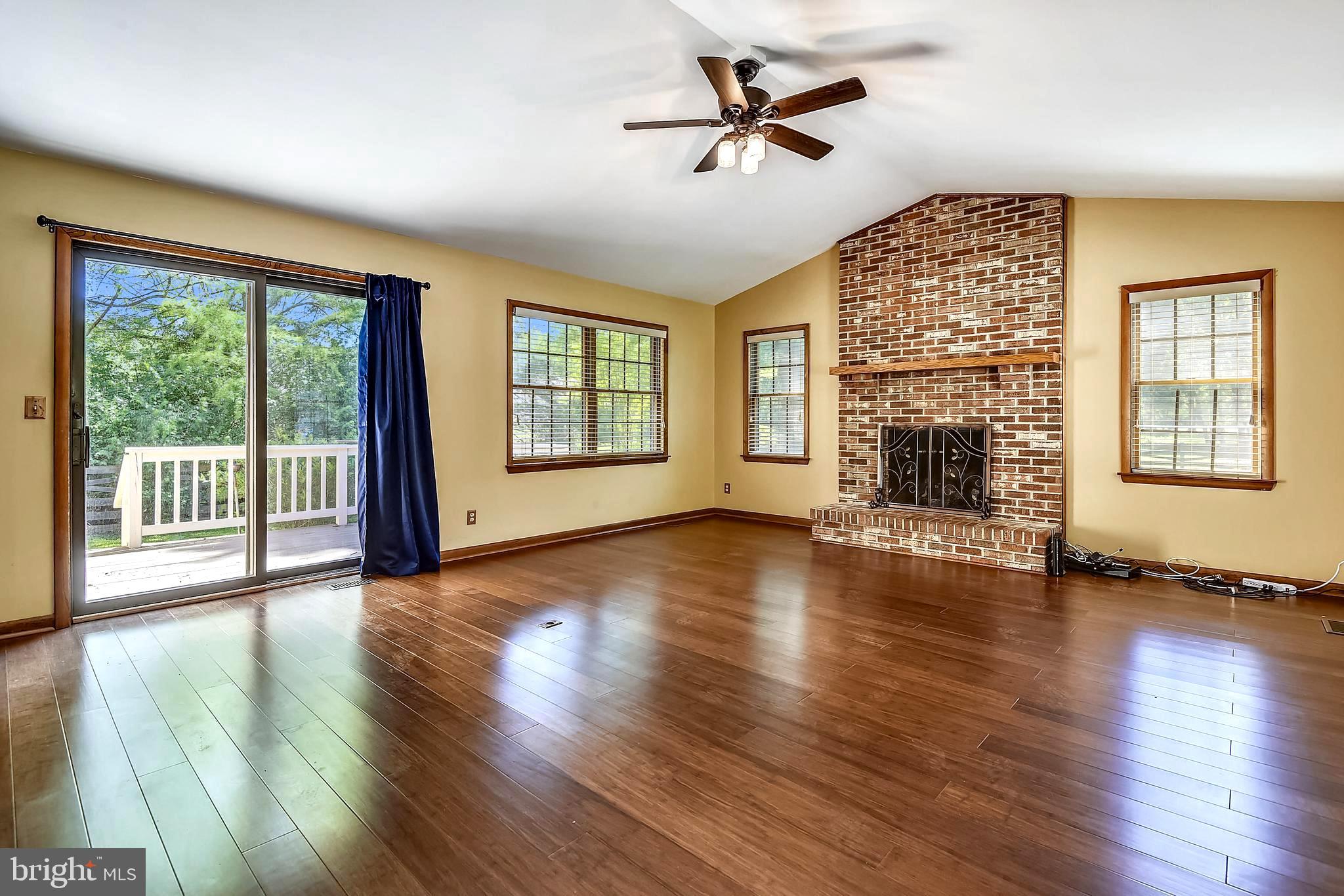 201 Queens Colony High Road Stevensville, MD 21666 - Photo 15 of 36 Brick Gas Fireplace and Sliders to Deck & Yard