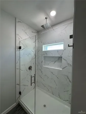 a bathroom with a shower and a toilet