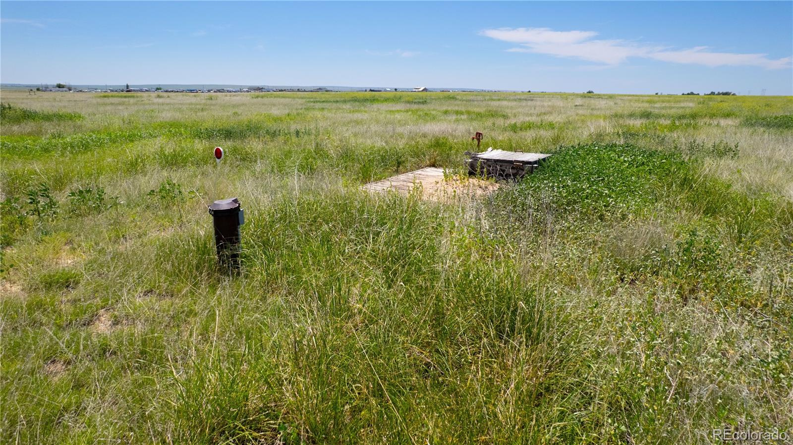 23655 East Garrett Road Calhan, CO 80808 - Photo 17 of 24 a view of a lake from a yard
