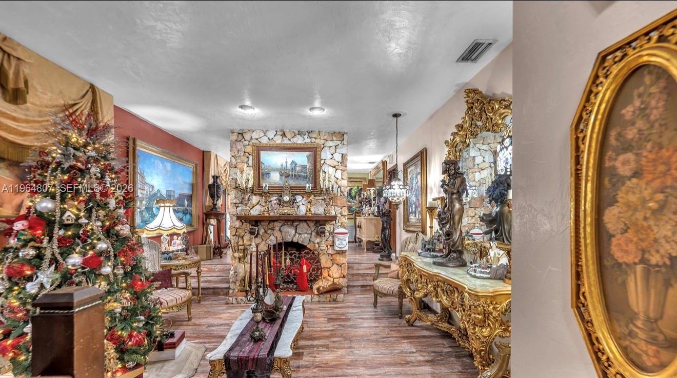 15425 Southwest 268th Street Homestead, FL 33032 - Photo 11 of 62 a living room with furniture and a fireplace