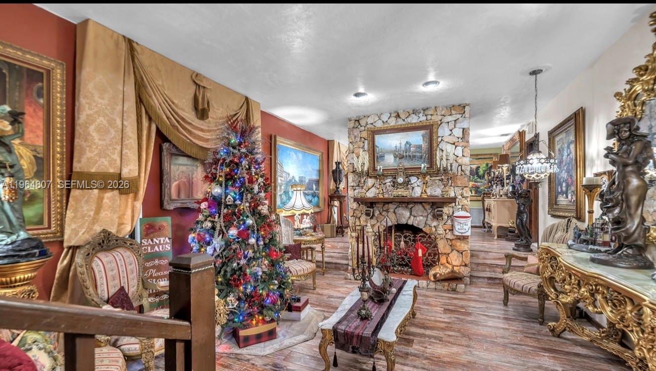 15425 Southwest 268th Street Homestead, FL 33032 - Photo 12 of 62 a living room filled with furniture and a fireplace