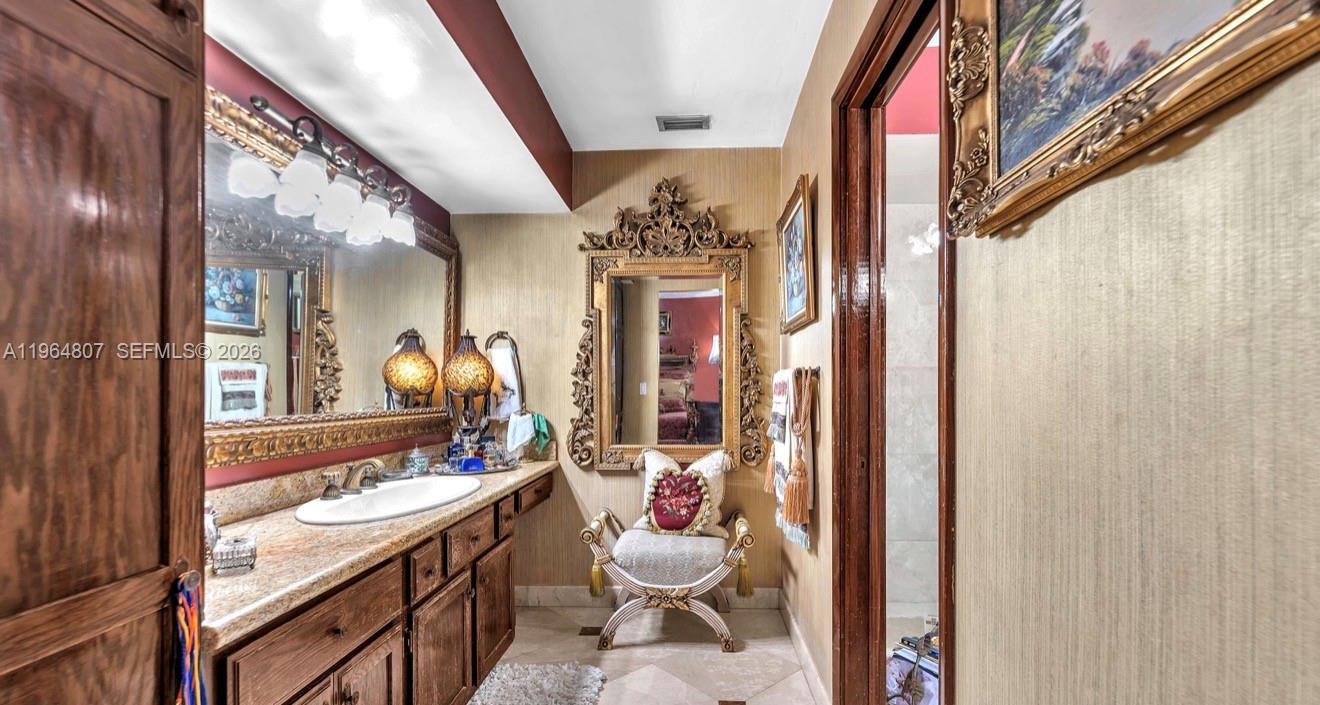 15425 Southwest 268th Street Homestead, FL 33032 - Photo 21 of 62 a bathroom with a granite countertop sink and a mirror
