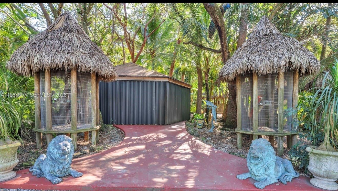 15425 Southwest 268th Street Homestead, FL 33032 - Photo 26 of 62 a view of a house with a yard and sitting area
