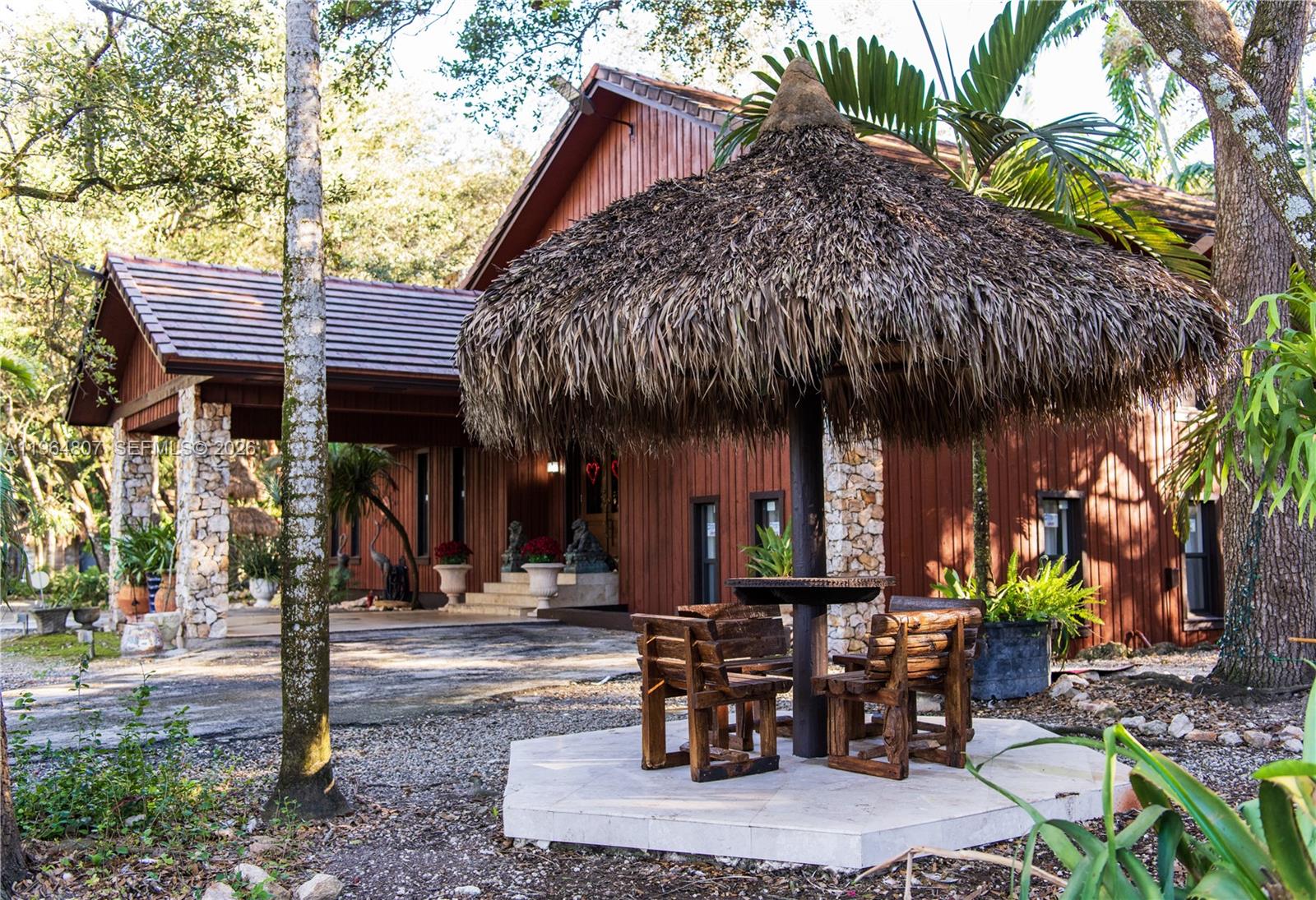 15425 Southwest 268th Street Homestead, FL 33032 - Photo 28 of 62 a view of a chairs and table in patio