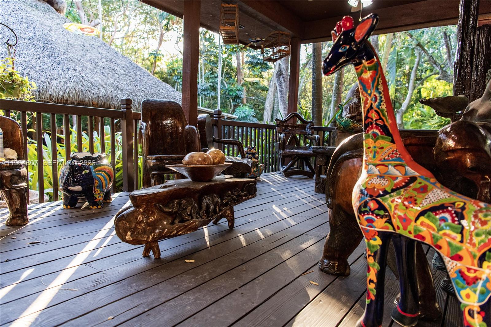 15425 Southwest 268th Street Homestead, FL 33032 - Photo 30 of 62 a living room filled with furniture and a potted plant