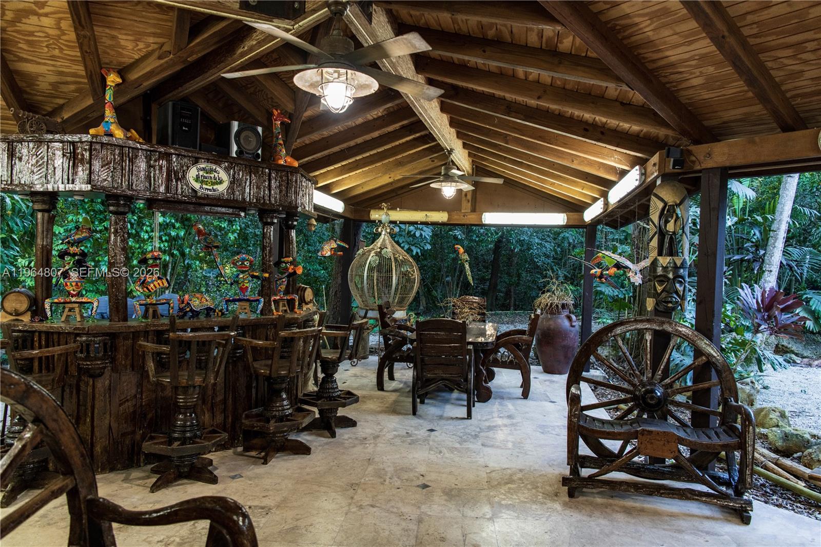 15425 Southwest 268th Street Homestead, FL 33032 - Photo 36 of 62 a view of a chairs and tables in patio