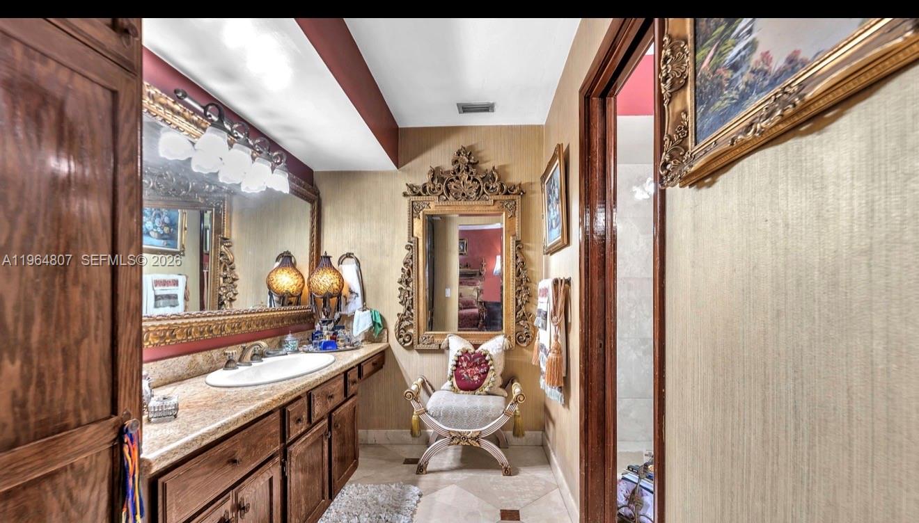 15425 Southwest 268th Street Homestead, FL 33032 - Photo 39 of 62 a bathroom with a sink vanity mirror and toilet