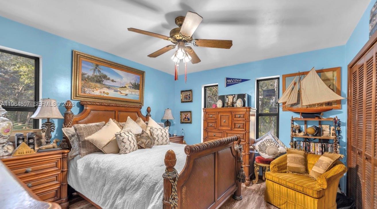 15425 Southwest 268th Street Homestead, FL 33032 - Photo 41 of 62 a living room with furniture a ceiling fan and a window