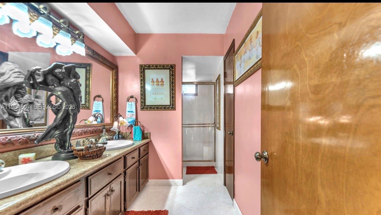 15425 Southwest 268th Street Homestead, FL 33032 - Photo 43 of 62 a kitchen with stainless steel appliances granite countertop a sink and a refrigerator