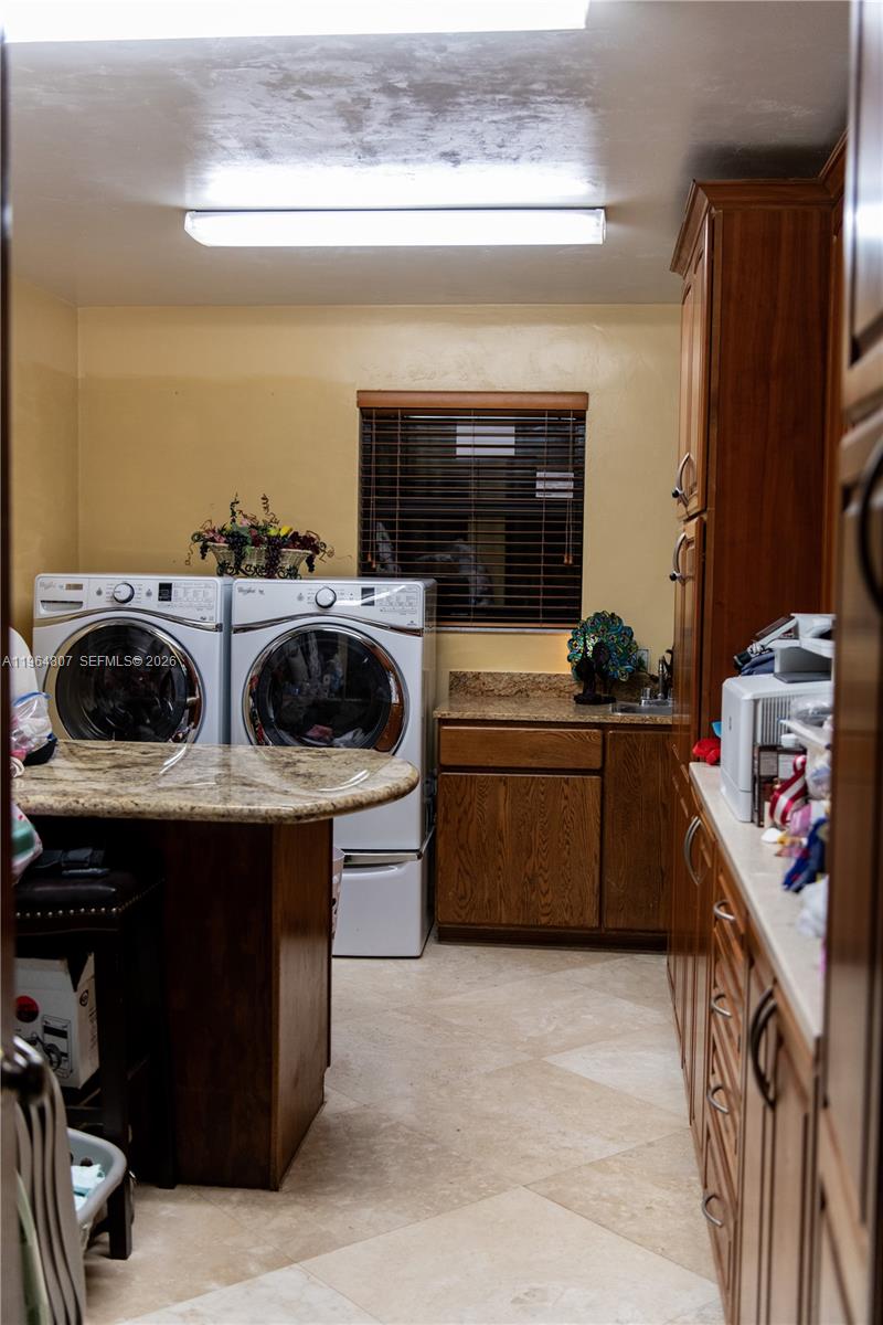 15425 Southwest 268th Street Homestead, FL 33032 - Photo 46 of 62 a kitchen with a stove and a refrigerator
