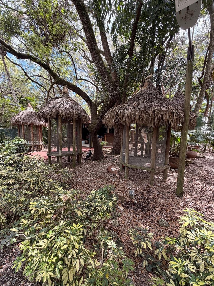 15425 Southwest 268th Street Homestead, FL 33032 - Photo 47 of 62 a view of a building with a trees