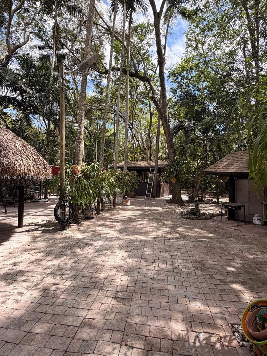 15425 Southwest 268th Street Homestead, FL 33032 - Photo 51 of 62 a view of a street with cars