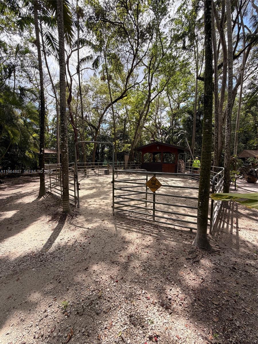 15425 Southwest 268th Street Homestead, FL 33032 - Photo 57 of 62 a view of outdoor space with deck and trees