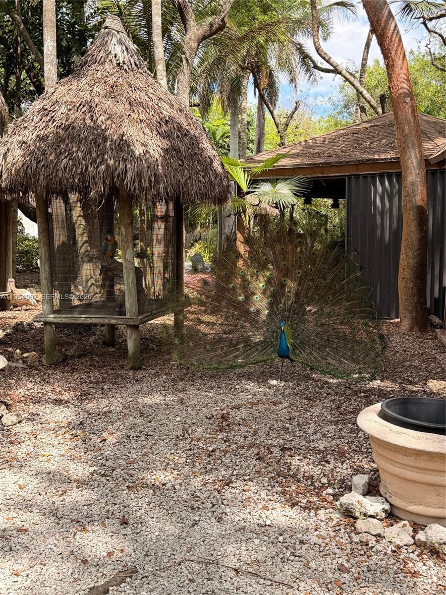 15425 Southwest 268th Street Homestead, FL 33032 - Photo 58 of 62 a view of a small house with yard and furniture