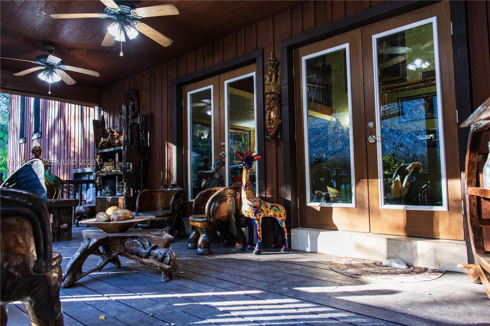 15425 Southwest 268th Street Homestead, FL 33032 - Photo 6 of 62 a view of a lobby with furniture and chandelier fan
