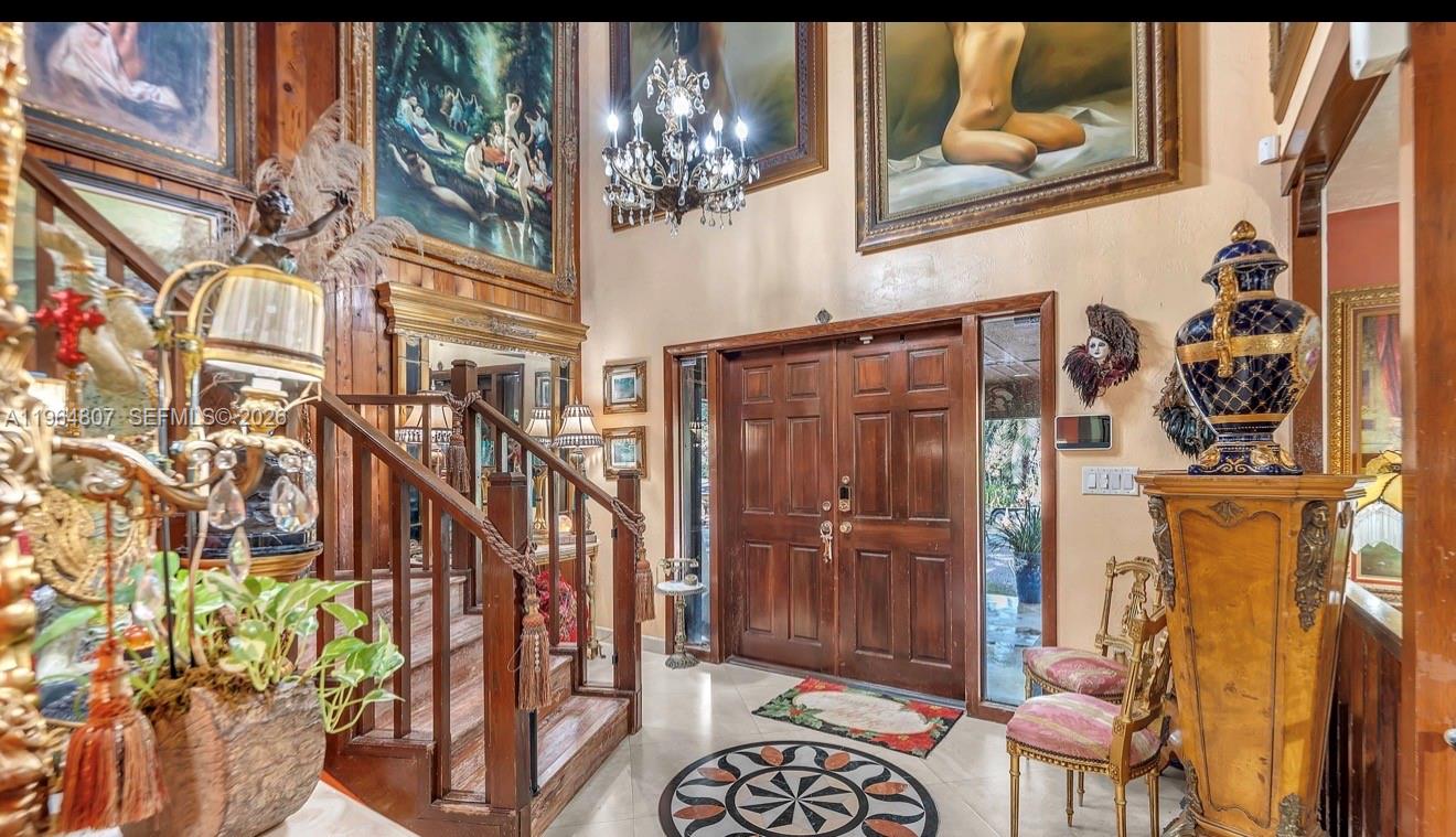 15425 Southwest 268th Street Homestead, FL 33032 - Photo 8 of 62 a view of entryway with a flower pot and a dining table