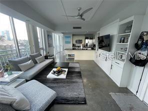 1350 Main Street, Unit 304 Sarasota, FL 34236 - Photo 14 of 14 a living room with furniture and a flat screen tv