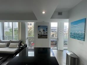 1350 Main Street, Unit 304 Sarasota, FL 34236 - Photo 2 of 14 a living room with furniture and a large window