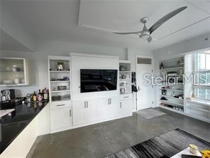1350 Main Street, Unit 304 Sarasota, FL 34236 - Photo 3 of 14 a living room with furniture and a flat screen tv