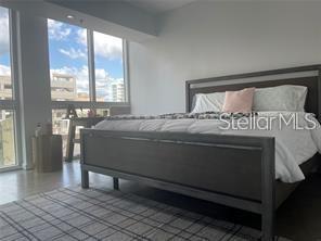 1350 Main Street, Unit 304 Sarasota, FL 34236 - Photo 6 of 14 a bedroom with a bed and window