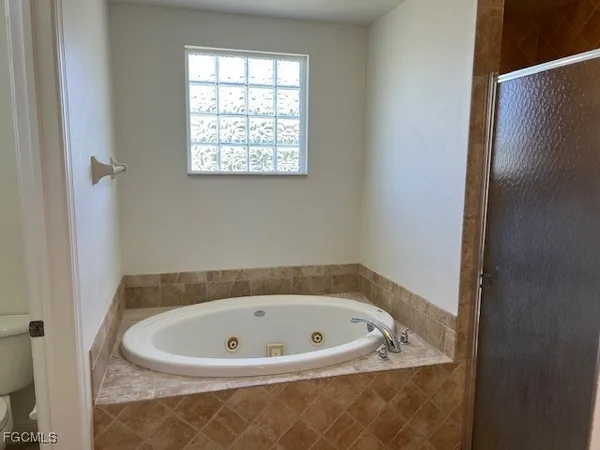 a white bath tub sitting in a bathroom