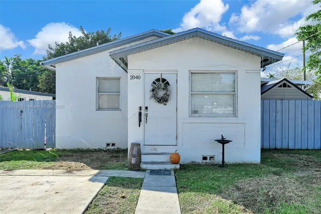 a view of backyard with a garden and entertaining space