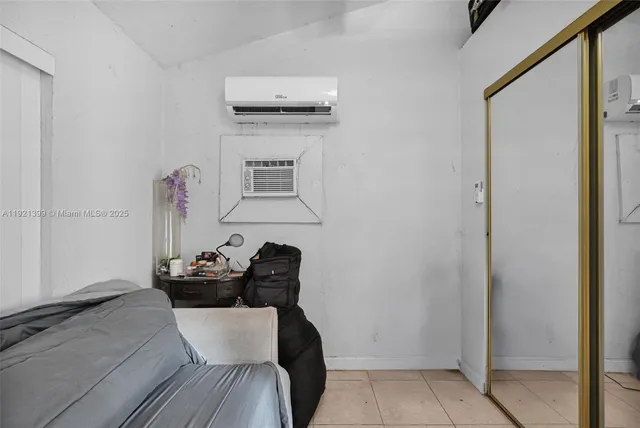 a bathroom with a sink a mirror and a shower