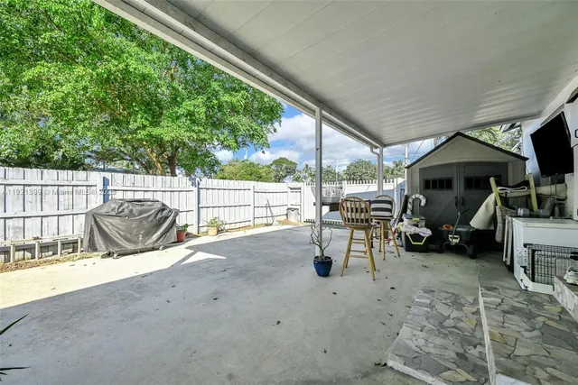 a backyard of a house with seating space