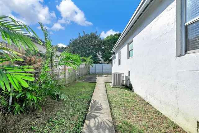 a backyard of a house with lots of green space