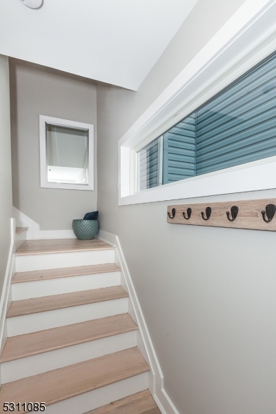 27 Mission Street, Unit 2 Montclair, NJ 07042 - Photo 2 of 18 a view of room with stairs and wooden floor