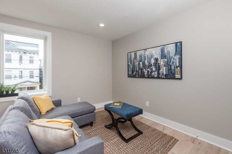 27 Mission Street, Unit 2 Montclair, NJ 07042 - Photo 7 of 18 a living room with furniture and a window