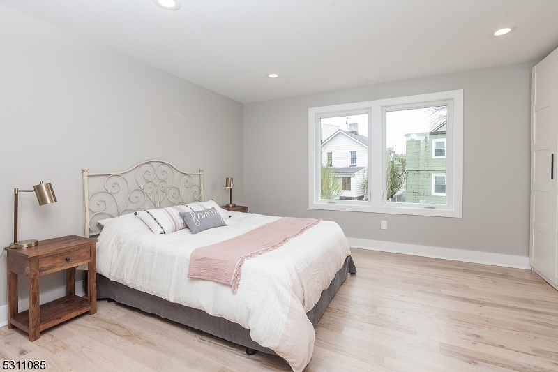 27 Mission Street, Unit 2 Montclair, NJ 07042 - Photo 9 of 18 a bedroom with a bed and a window