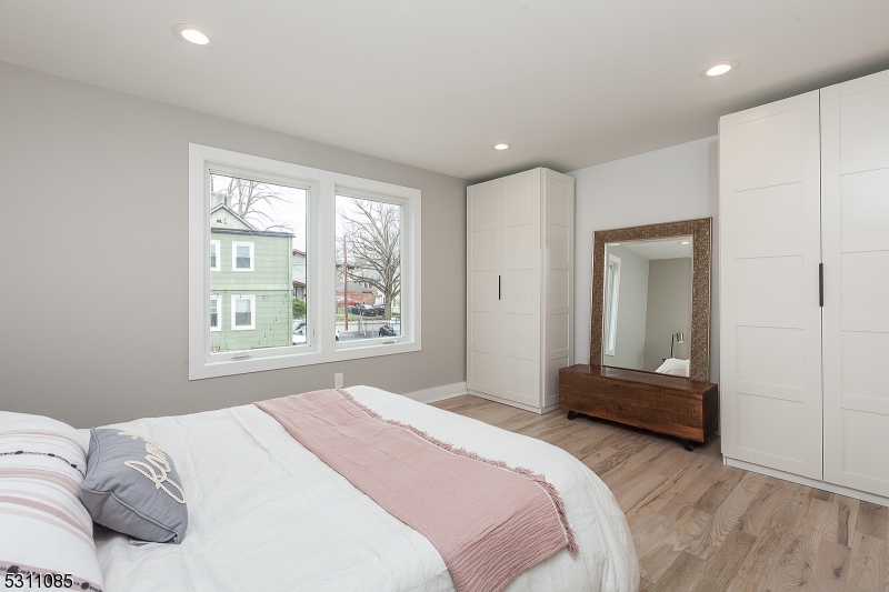 27 Mission Street, Unit 2 Montclair, NJ 07042 - Photo 10 of 18 a bedroom with a bed and a large window