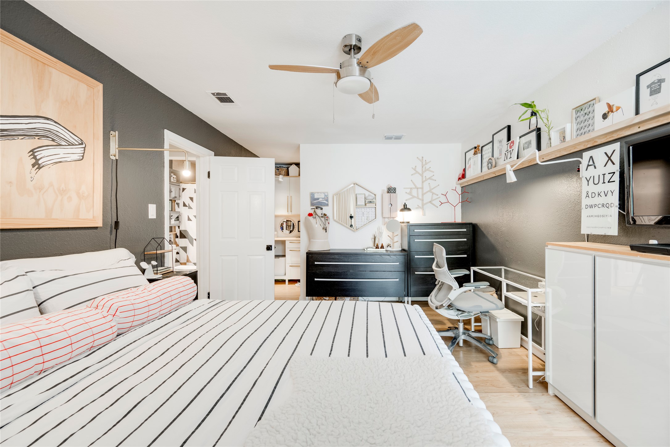 3627 Menchaca Road, Unit 214 Austin, TX 78704 - Photo 17 of 28 Comfortable bedroom offers a built-in closet with ample storage.