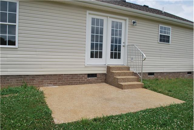 144 T G T Road Portland, TN 37148 - Photo 15 of 20 Your relaxing patio is low maintenance with just two steps to your grill