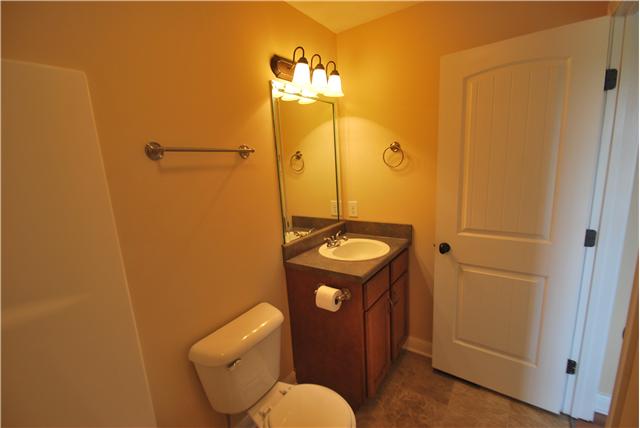 144 T G T Road Portland, TN 37148 - Photo 8 of 20 Guest bath has tall custom cabinets and is located opposite end of home for privacy