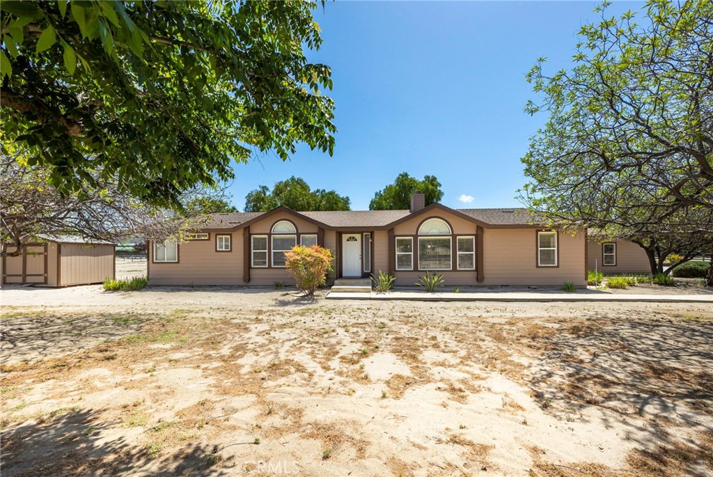 37055 De Portola Road Temecula, CA 92592 - Photo 28 of 67 a front view of a house with a yard