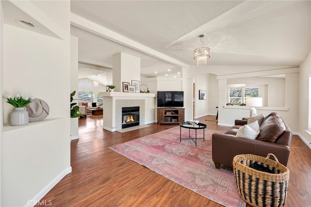 37055 De Portola Road Temecula, CA 92592 - Photo 30 of 67 a living room with furniture a fireplace and a table
