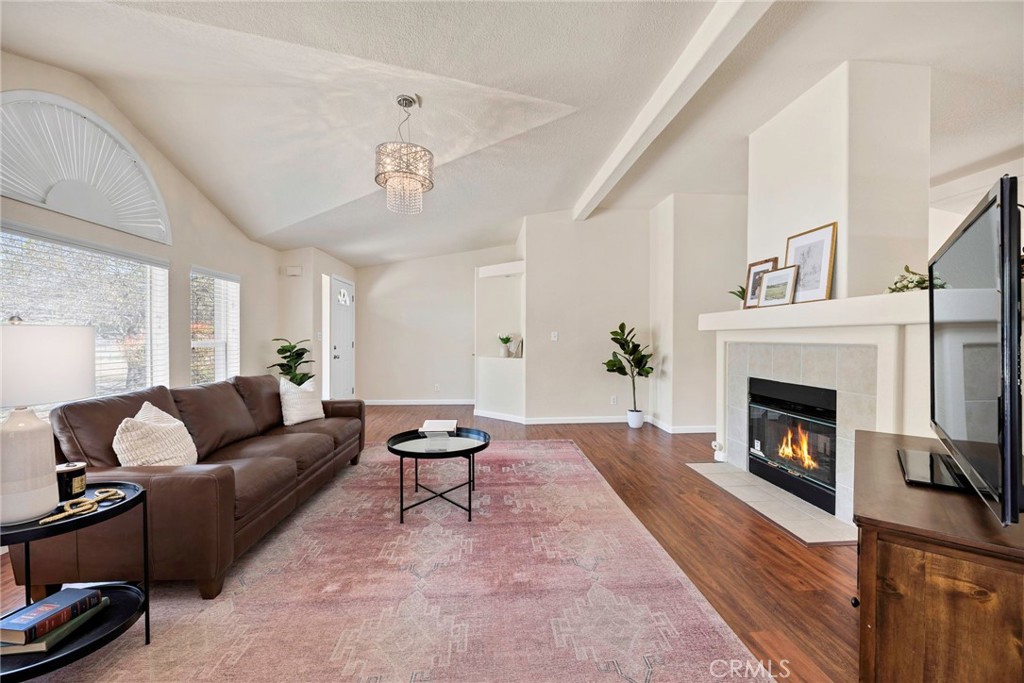 37055 De Portola Road Temecula, CA 92592 - Photo 33 of 67 a living room with furniture and a fireplace