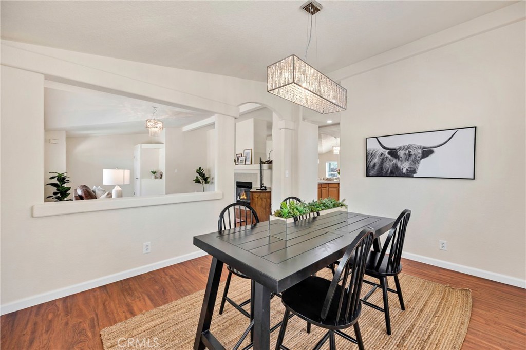 37055 De Portola Road Temecula, CA 92592 - Photo 35 of 67 a view of a dining room with furniture and wooden floor