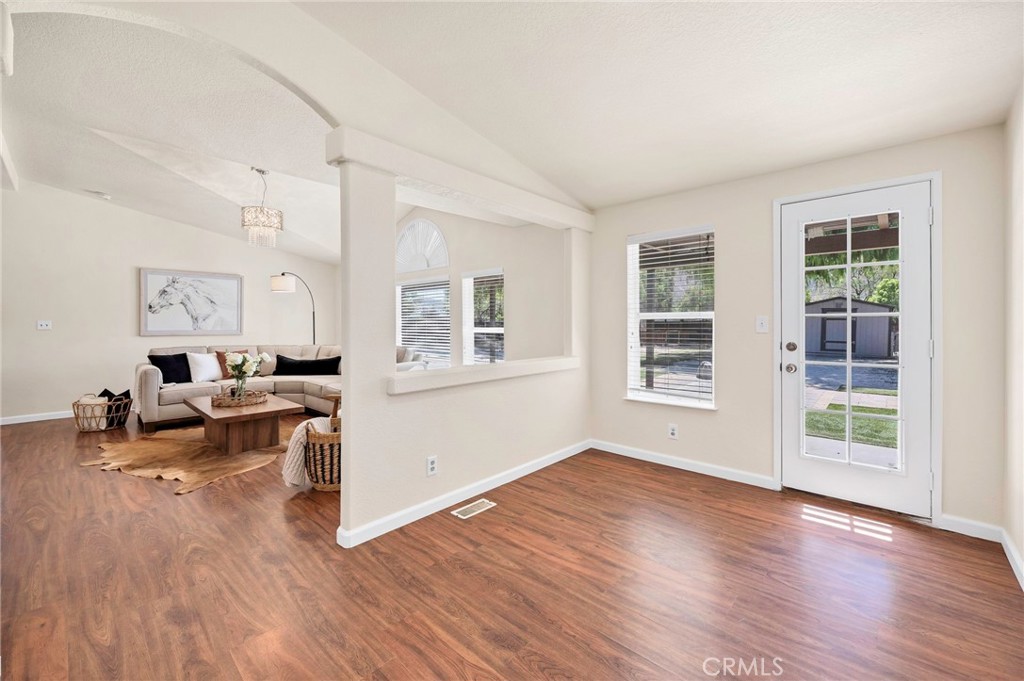 37055 De Portola Road Temecula, CA 92592 - Photo 40 of 67 a living room with furniture and a wooden floor
