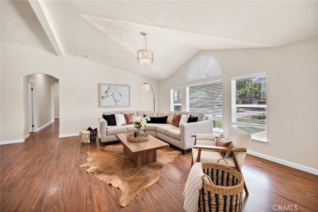 37055 De Portola Road Temecula, CA 92592 - Photo 41 of 67 a living room with furniture large window and wooden floor