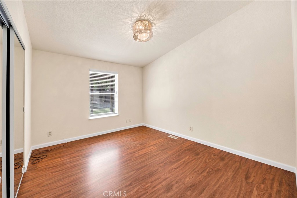 37055 De Portola Road Temecula, CA 92592 - Photo 49 of 67 an empty room with wooden floor and windows