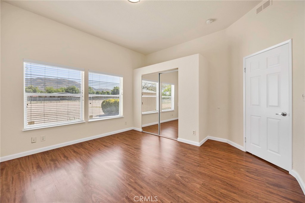 37055 De Portola Road Temecula, CA 92592 - Photo 51 of 67 a view of an empty room with wooden floor and a window