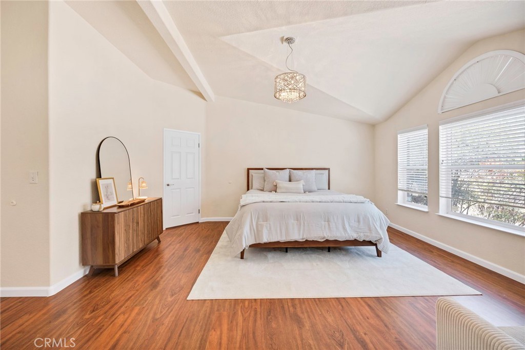 37055 De Portola Road Temecula, CA 92592 - Photo 54 of 67 a bedroom with a bed and a large window with wooden floor