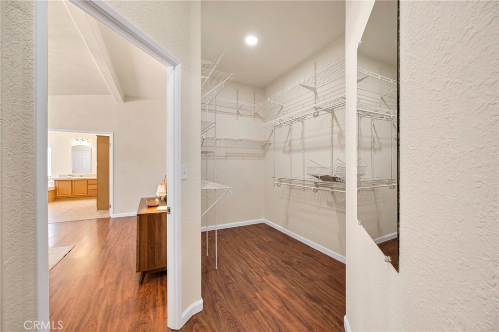 37055 De Portola Road Temecula, CA 92592 - Photo 55 of 67 a view of a hallway with wooden floor and staircase