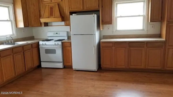 a white refrigerator freezer sitting in a kitchen