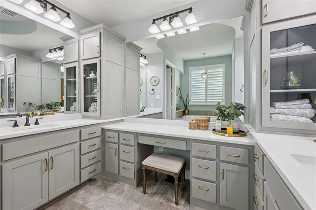 a bathroom with a sink double vanity and a mirror
