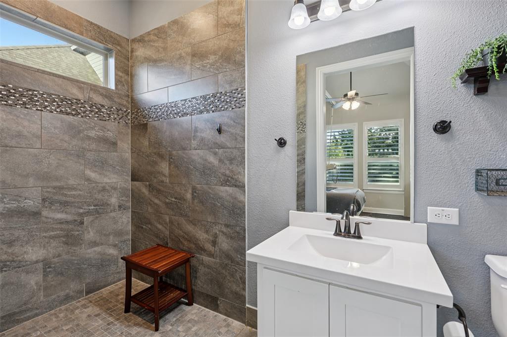 451 Morgan Lane Prosper, TX 75078 - Photo 25 of 38 a bathroom with a sink a toilet and shower