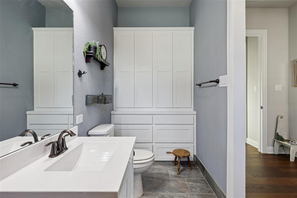 451 Morgan Lane Prosper, TX 75078 - Photo 26 of 38 a bathroom with a sink and a tub